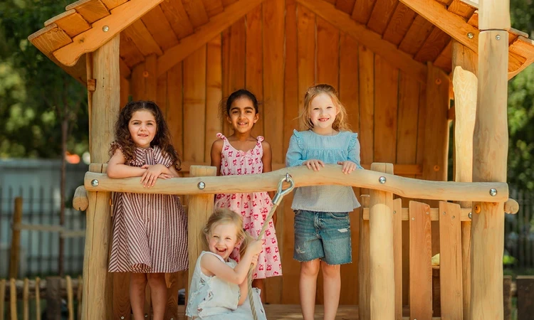 Four girls at the playhouse