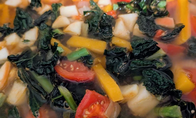 Simmering vegetables and diced apple