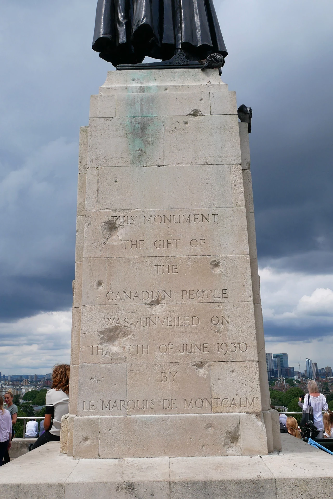 Bomb damage is visible on the plinth of the Wolfe statue