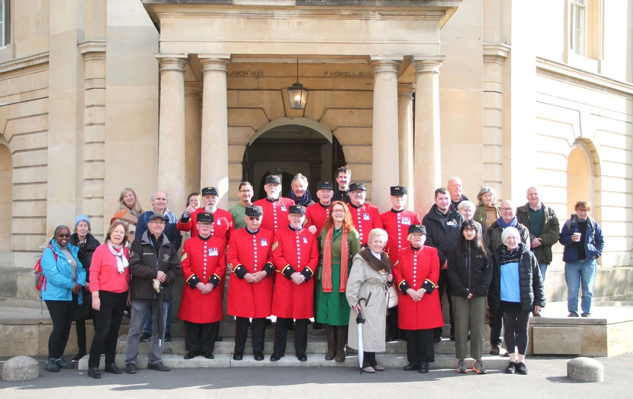 Chelsea Pensioners standing for a group portrait at Brompton Cemetery