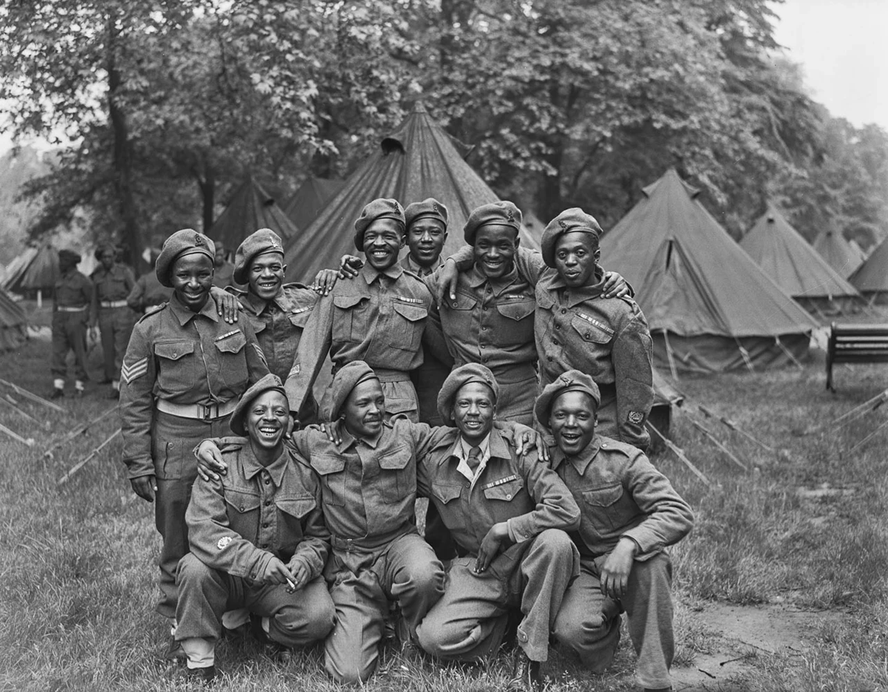 A group of African soldiers pose together for a photo in Kensington Gardens, 1946