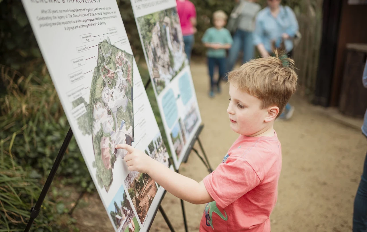 Young boy looking at an information board