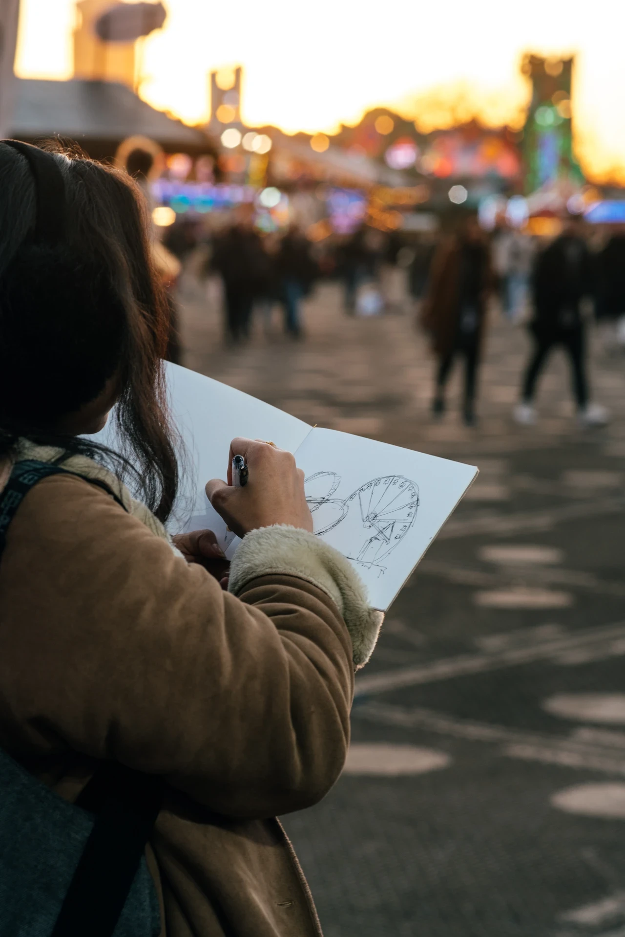 Person drawing as part of Winter Wonderland School Art Competition