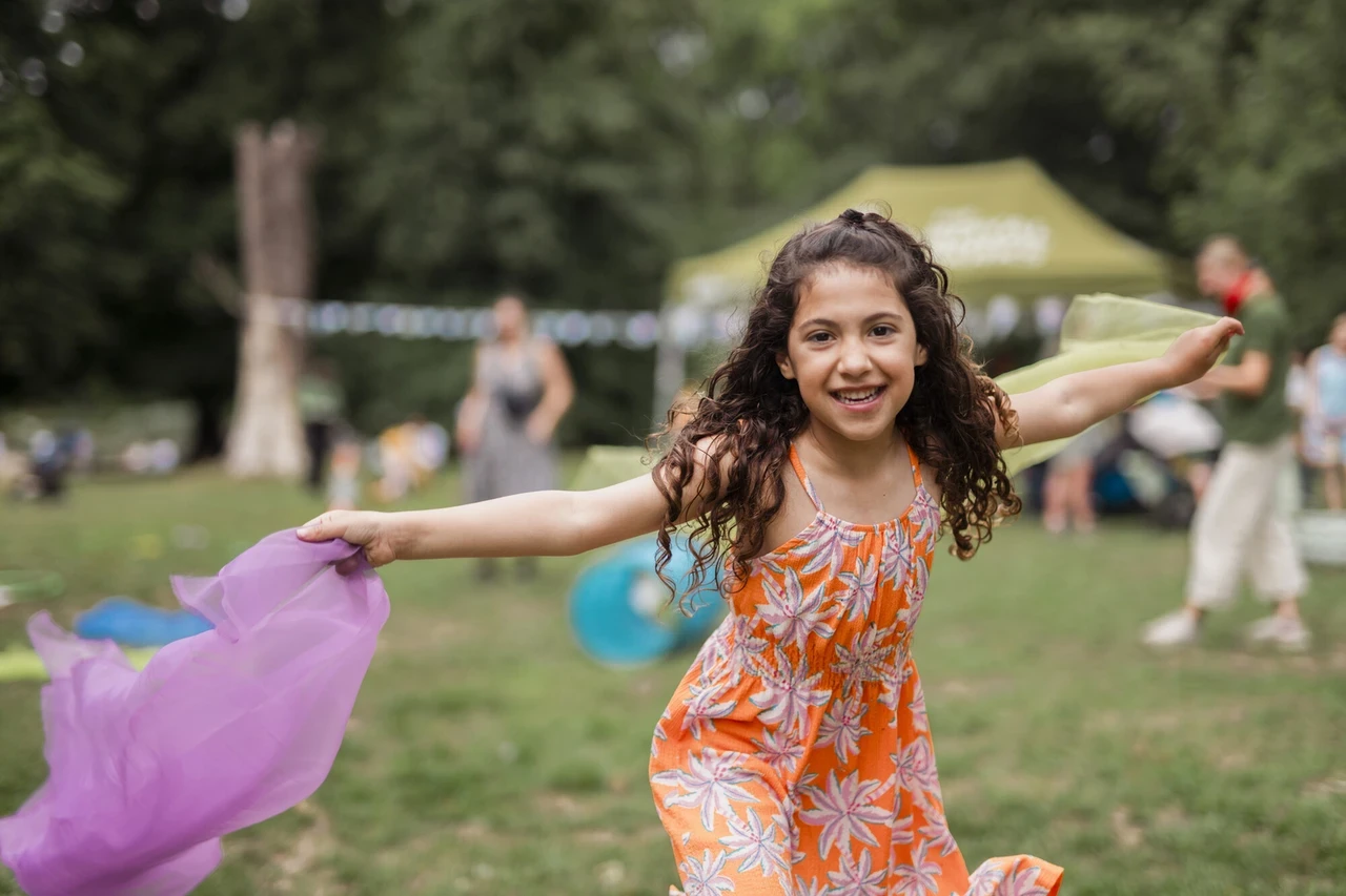 Child playing in park as part of the Play in the Park project