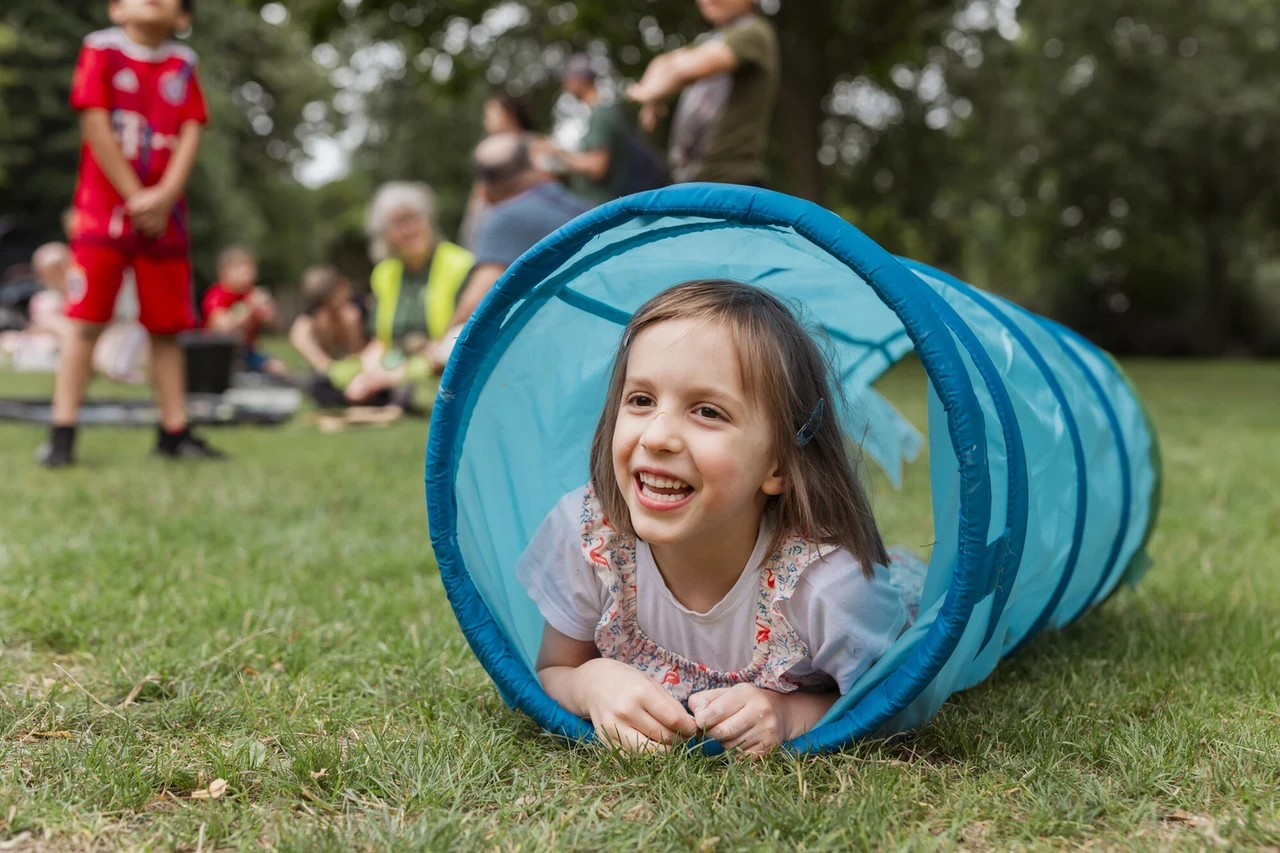 Child playing in park as part of the Play in the Park project
