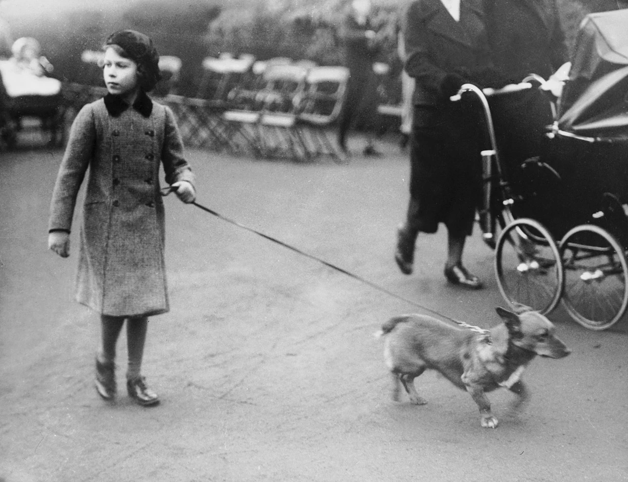 Princess Elizabeth exercising one of her Corgi dogs in London's Hyde Park