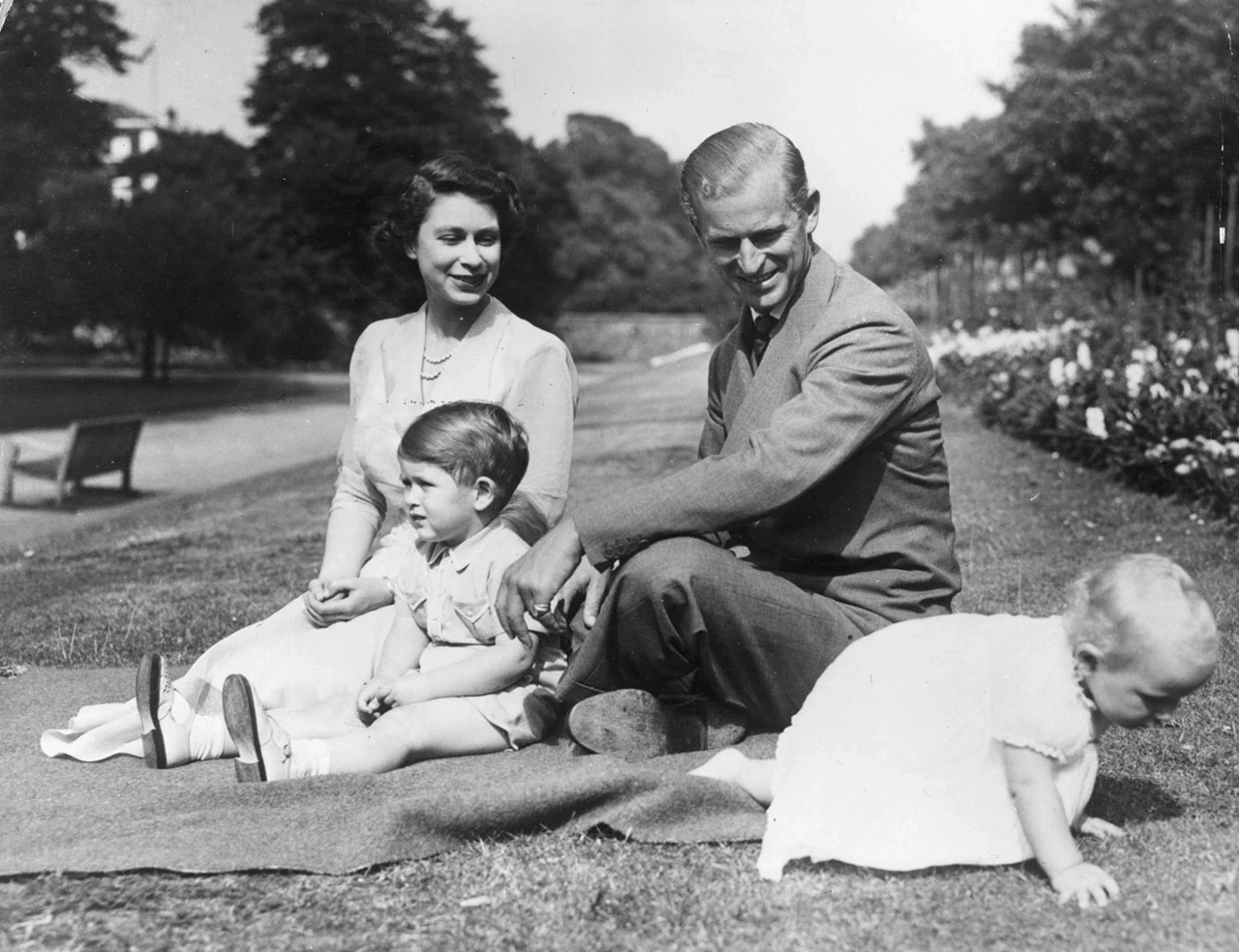 Princess Elizabeth and Prince Philip, Duke of Edinburgh with their two children, Prince Charles and Princess Anne in the grounds of Clarence House, London