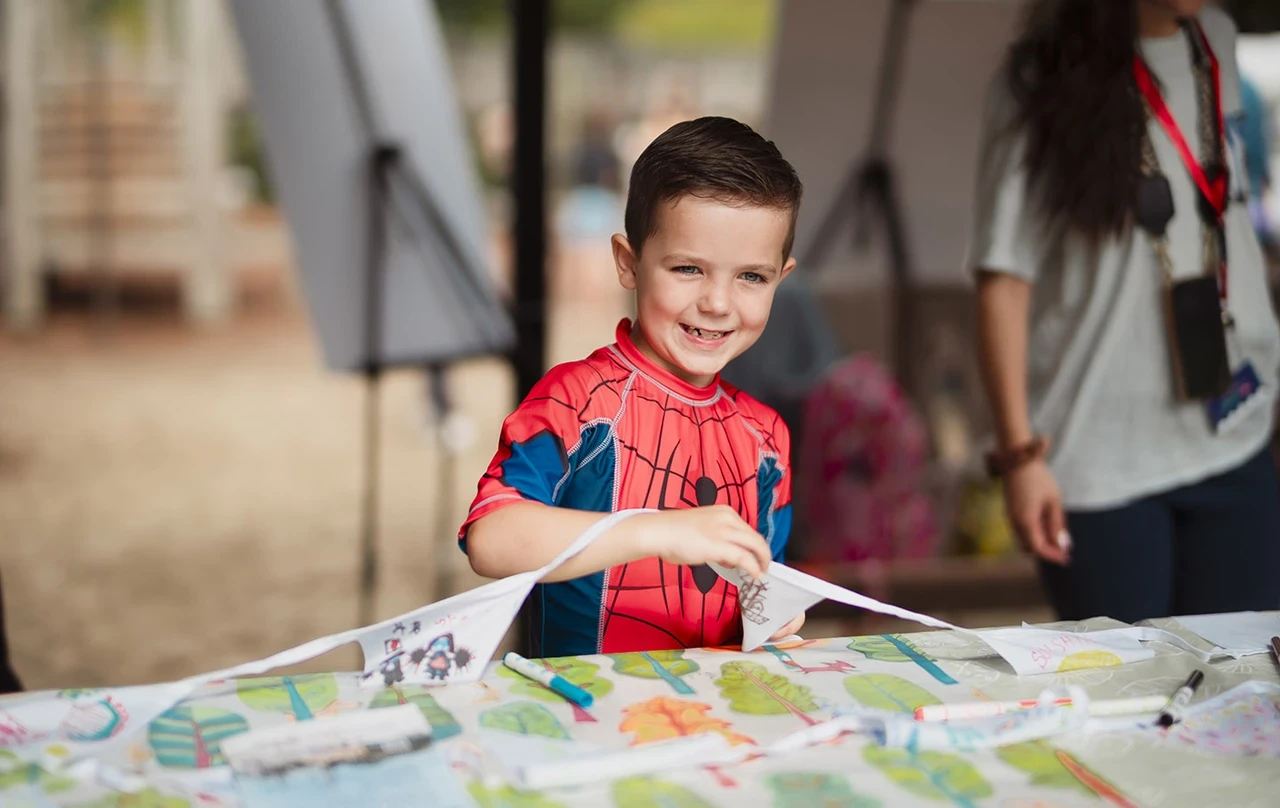 Young boy designing bunting