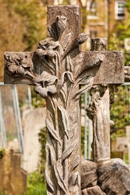 close up image of lilies on a cross